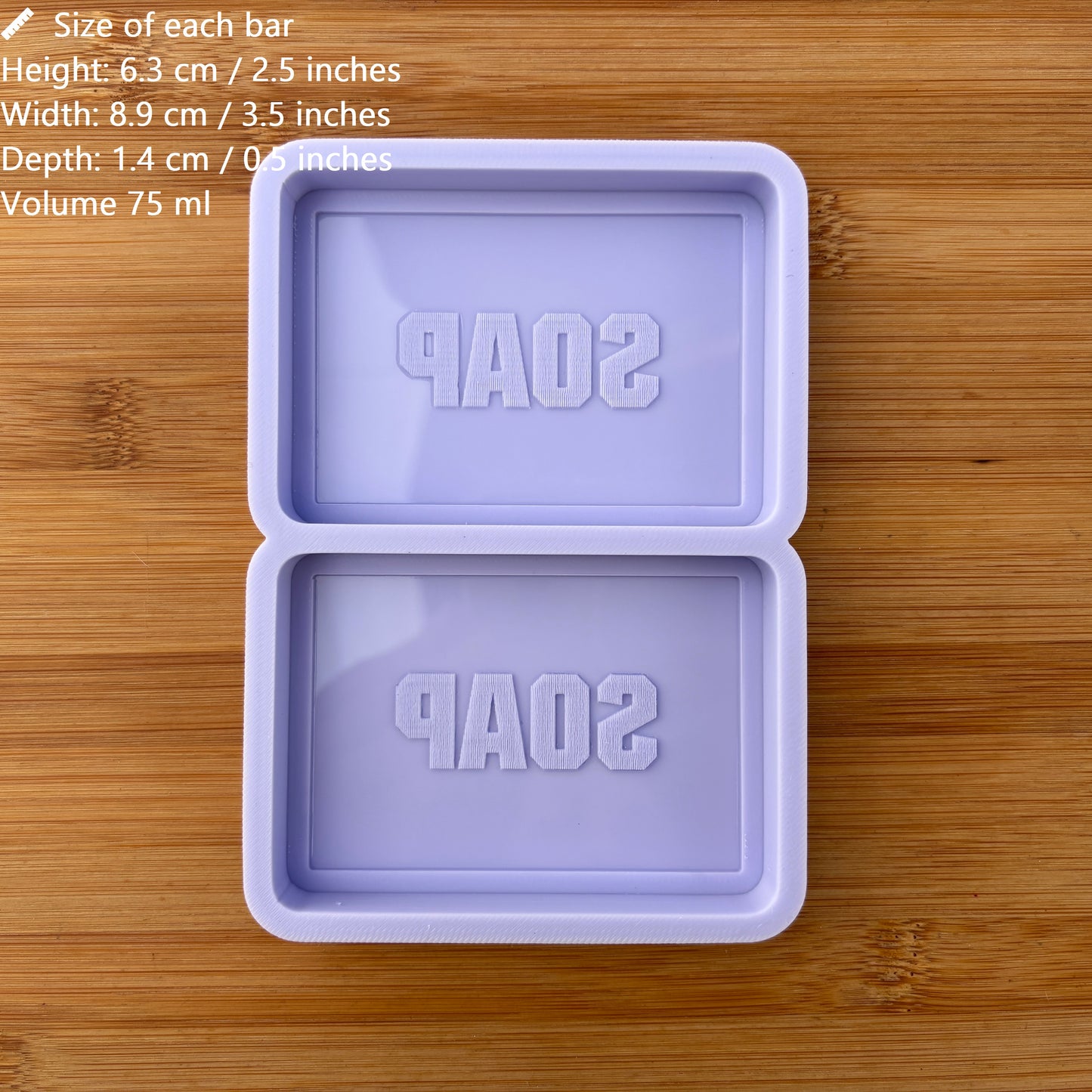 Purple soap mold with 'SOAP' text on a wooden surface