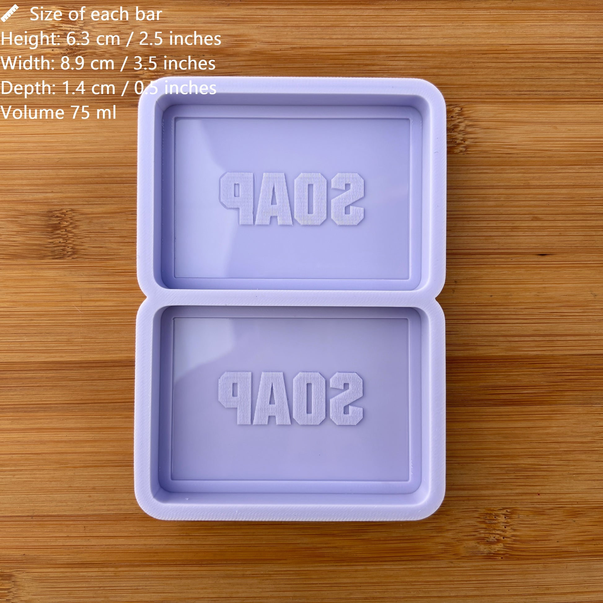 Purple soap mold with 'SOAP' text on a wooden surface