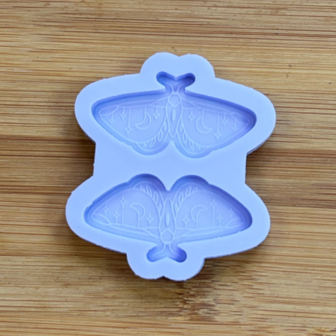 Moth silicone mold with 2 cavities made from food safe silicone.