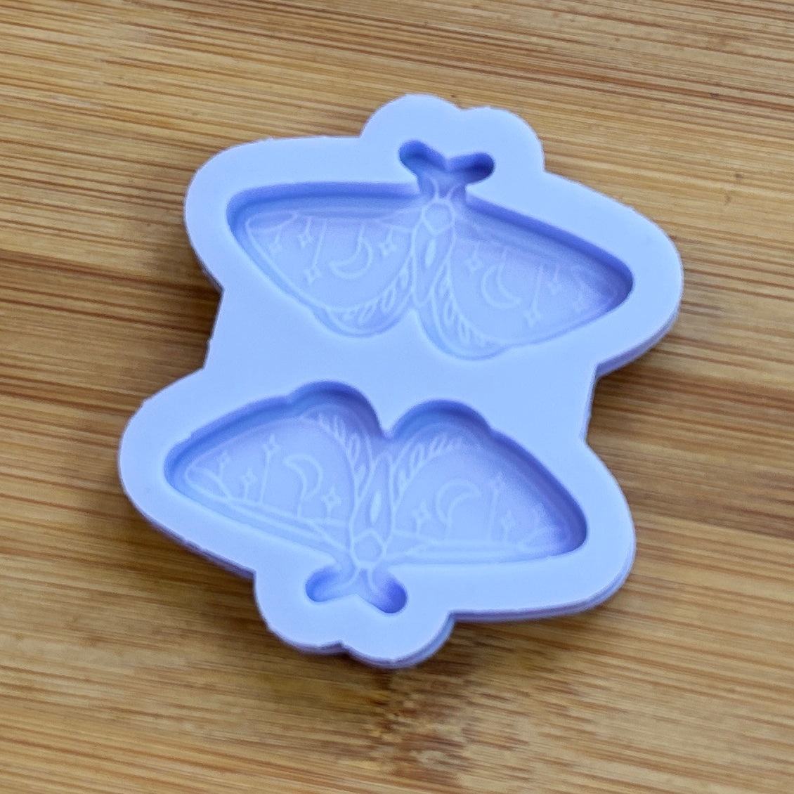 Moth silicone mold with 2 cavities made from food safe silicone.