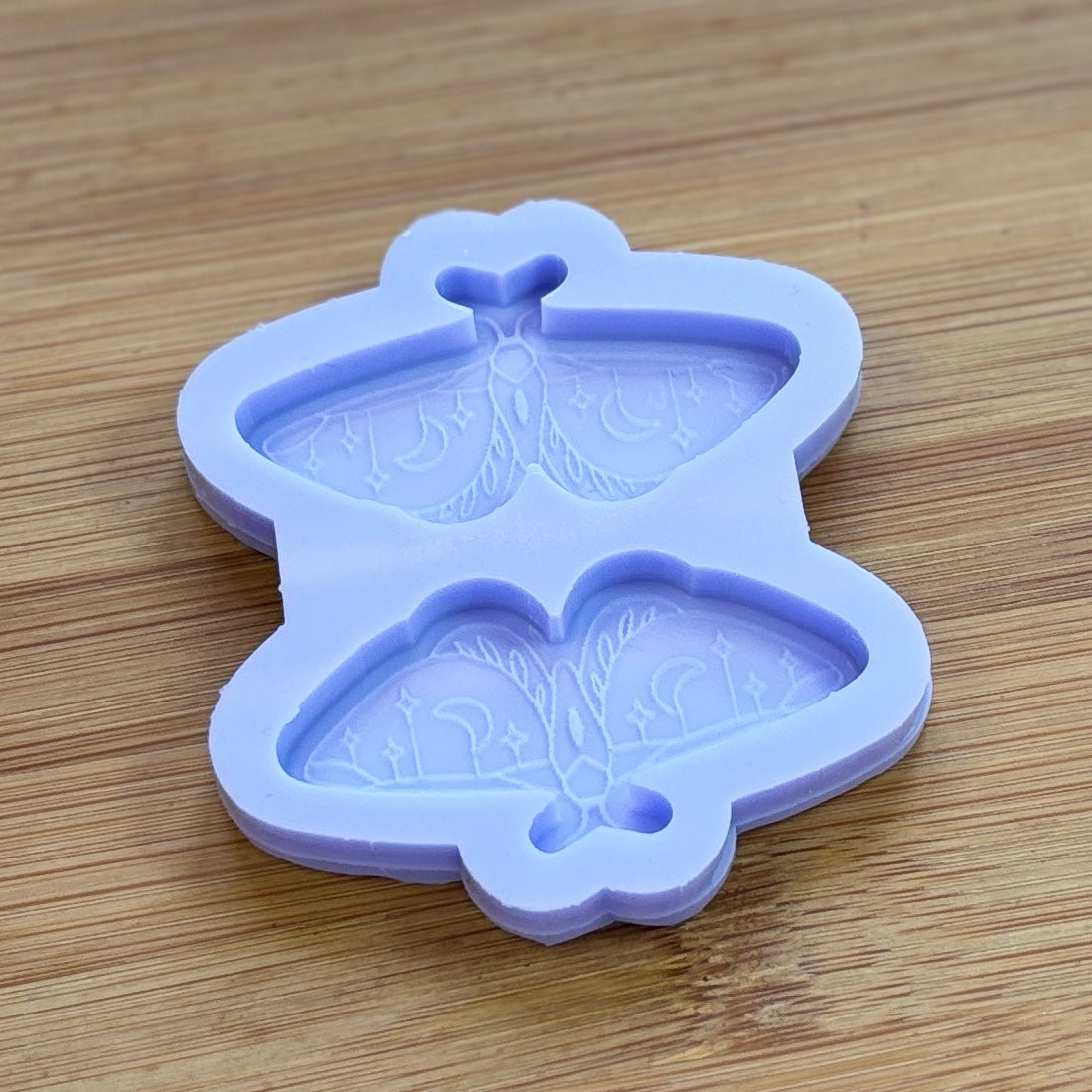 Moth silicone mold with 2 cavities made from food safe silicone.