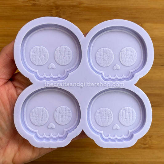Cute Skull Silicone Mold with 4 cavities of 2 inches each, made from food safe silicone. Oven and freezer safe.