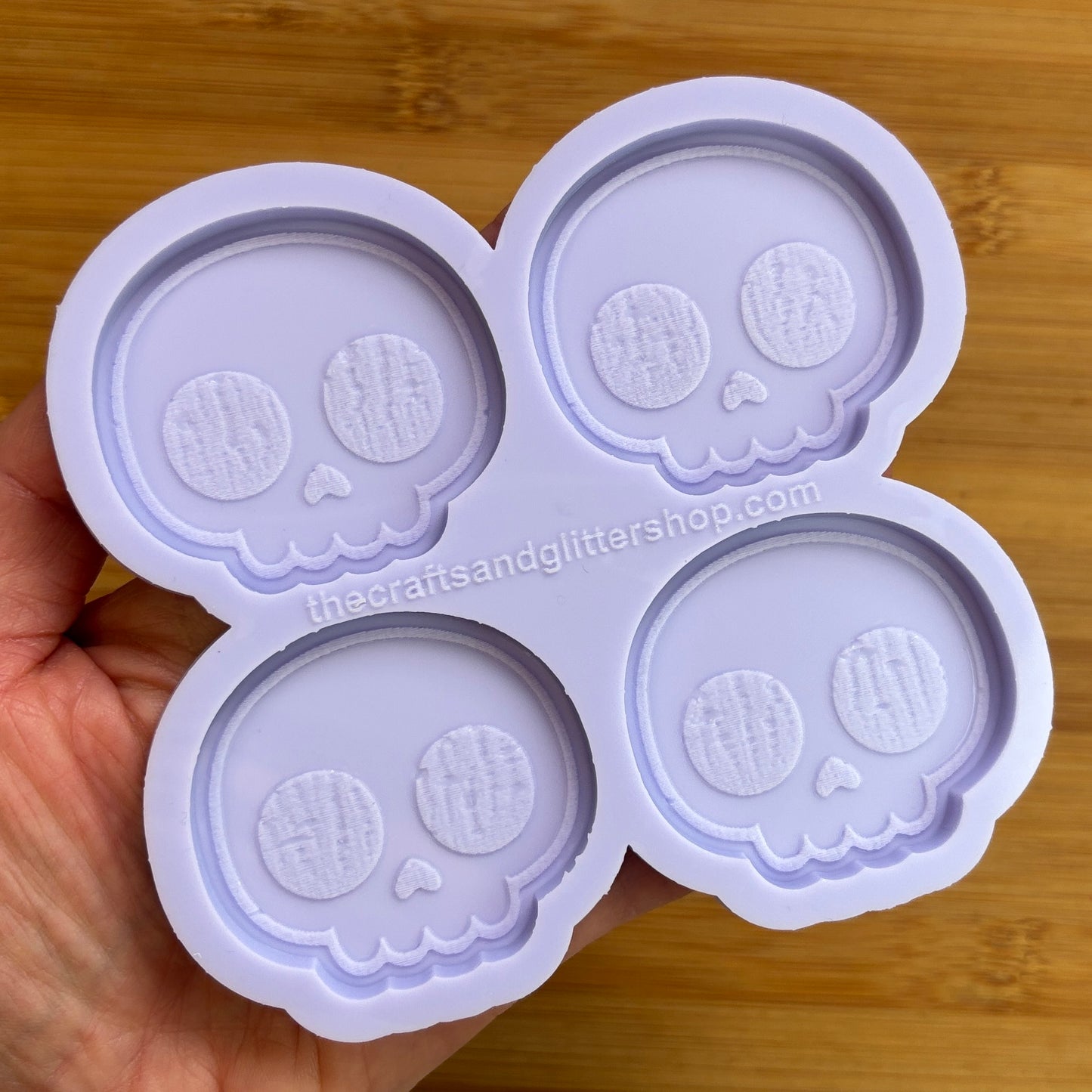 Cute Skull Silicone Mold with 4 cavities of 2 inches each, made from food safe silicone. Oven and freezer safe.