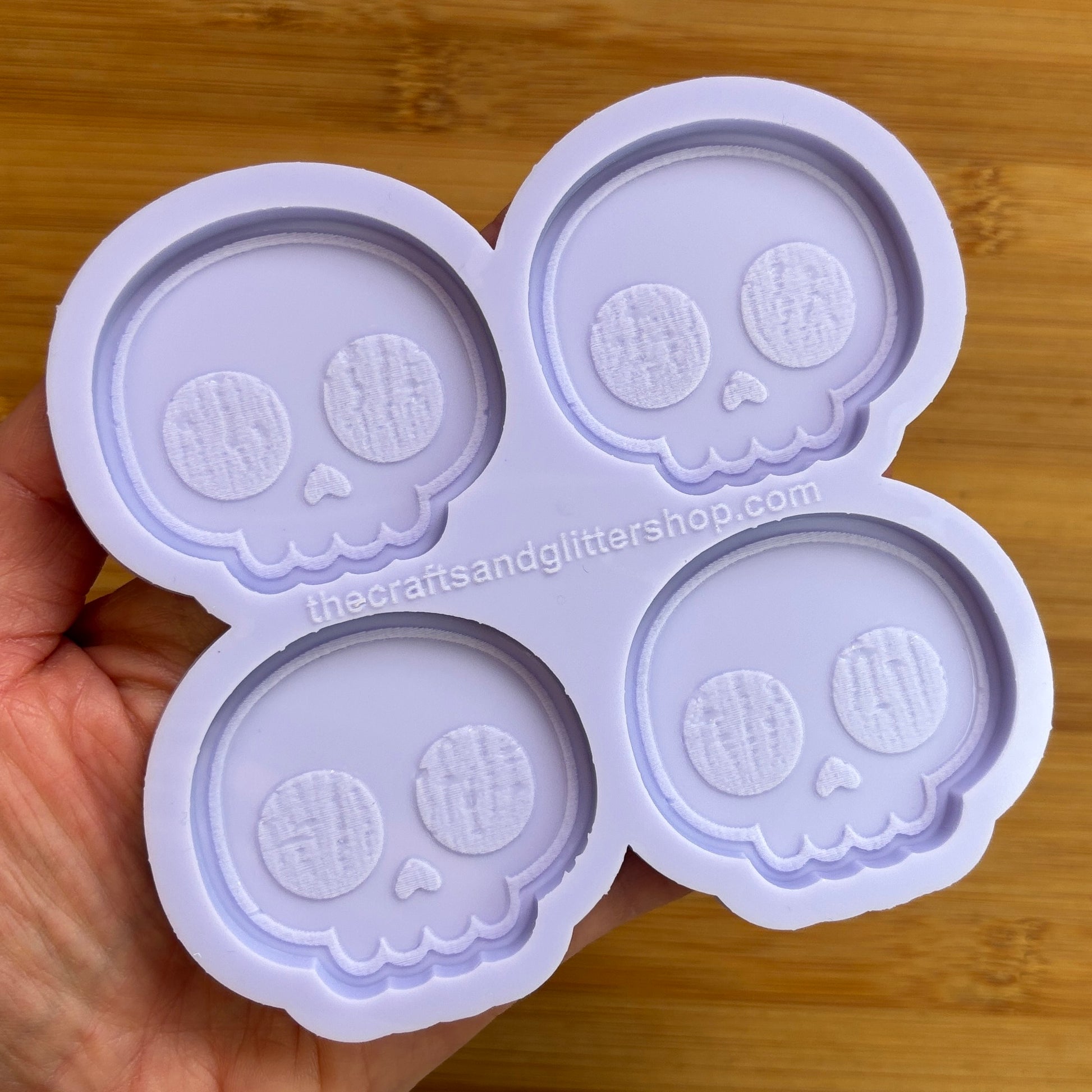 Cute Skull Silicone Mold with 4 cavities of 2 inches each, made from food safe silicone. Oven and freezer safe.