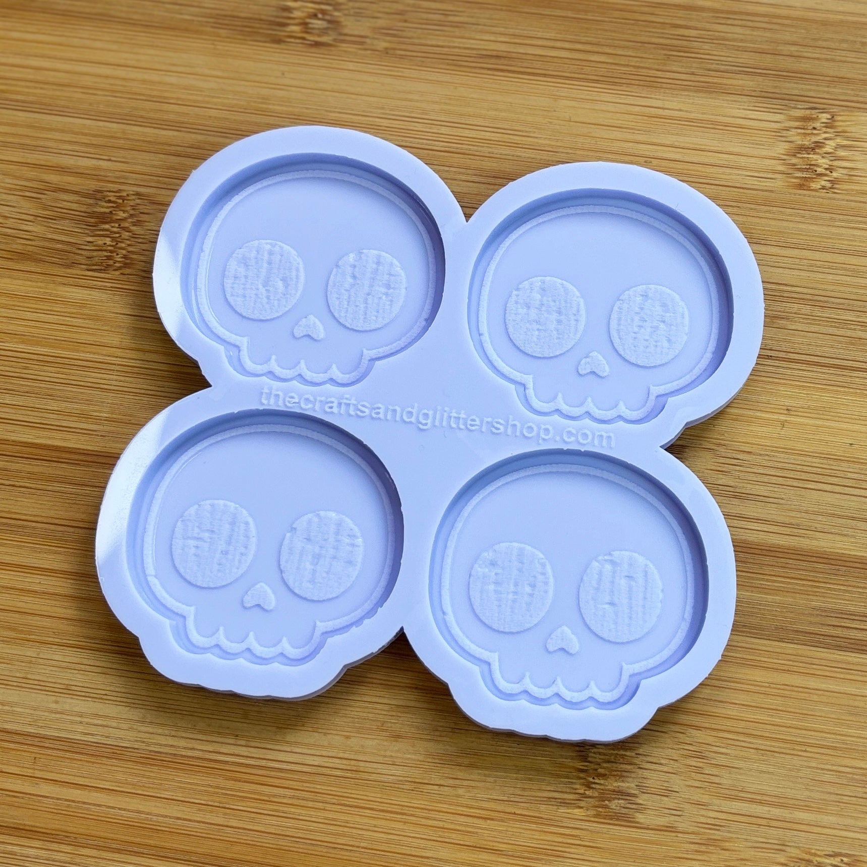 Cute Skull Silicone Mold with 4 cavities of 2 inches each, made from food safe silicone. Oven and freezer safe.