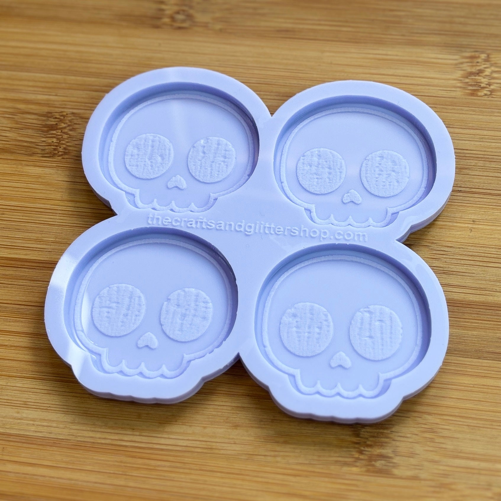 Cute Skull Silicone Mold with 4 cavities of 2 inches each, made from food safe silicone. Oven and freezer safe.