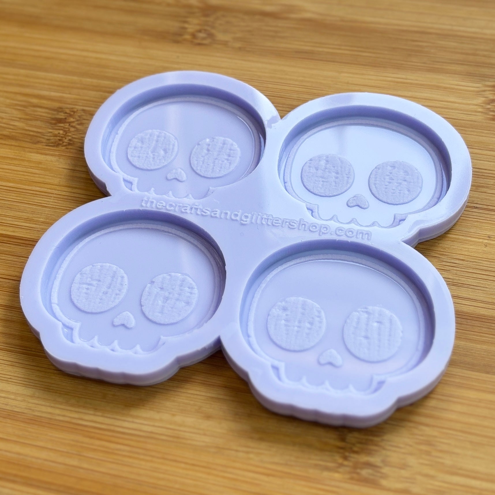 Cute Skull Silicone Mold with 4 cavities of 2 inches each, made from food safe silicone. Oven and freezer safe.