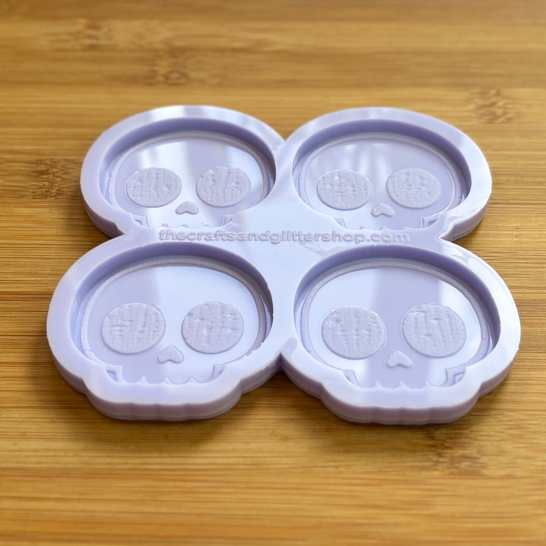Cute Skull Silicone Mold with 4 cavities of 2 inches each, made from food safe silicone. Oven and freezer safe.