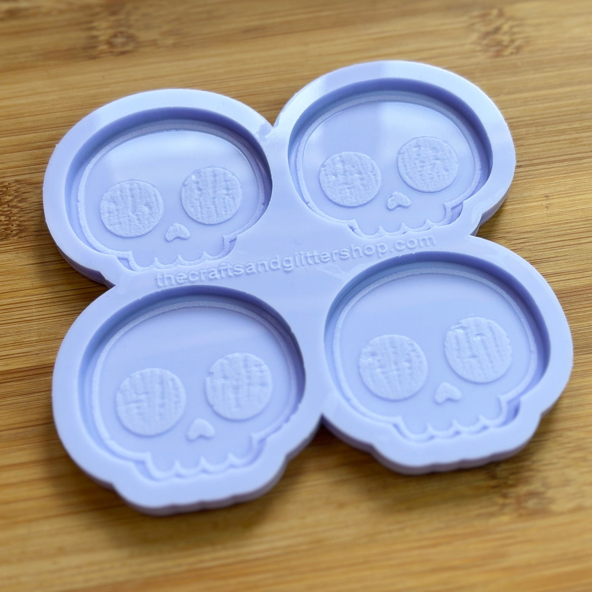 Cute Skull Silicone Mold with 4 cavities of 2 inches each, made from food safe silicone. Oven and freezer safe.