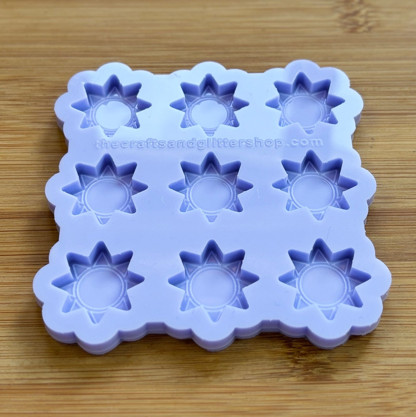 Sun silicone mold with 9 cavities, made from food safe silicone.
