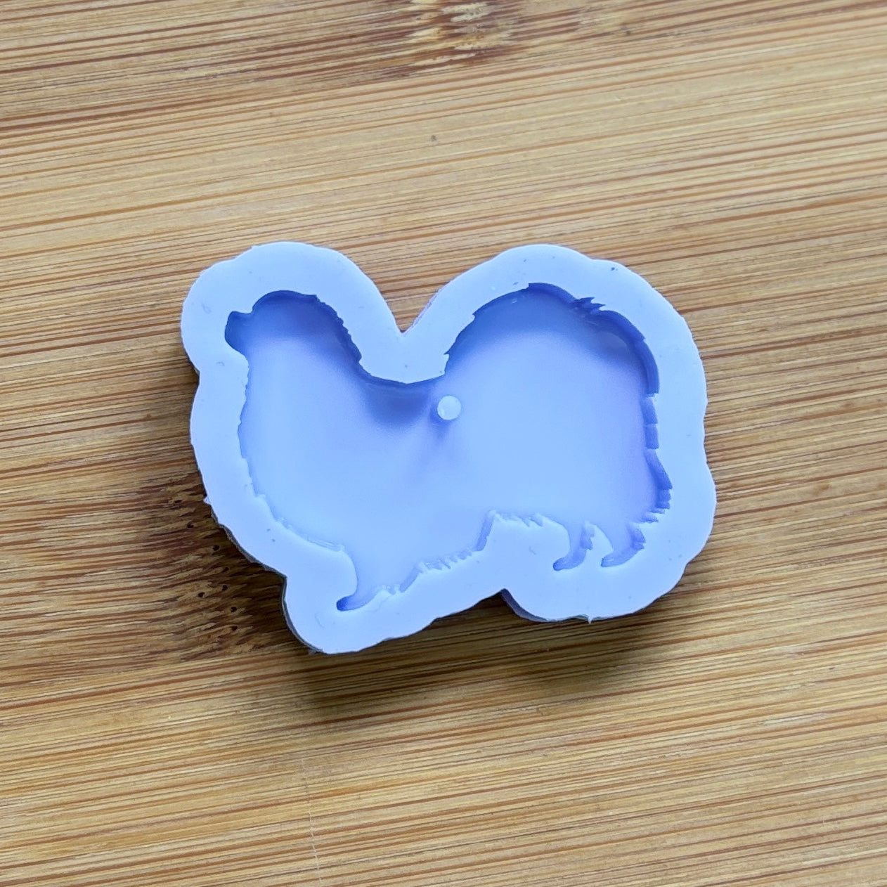 Tibetan Spaniel Silicone Mold with 1 cavity, made with Food Safe Silicone suitable for both food and craft projects.