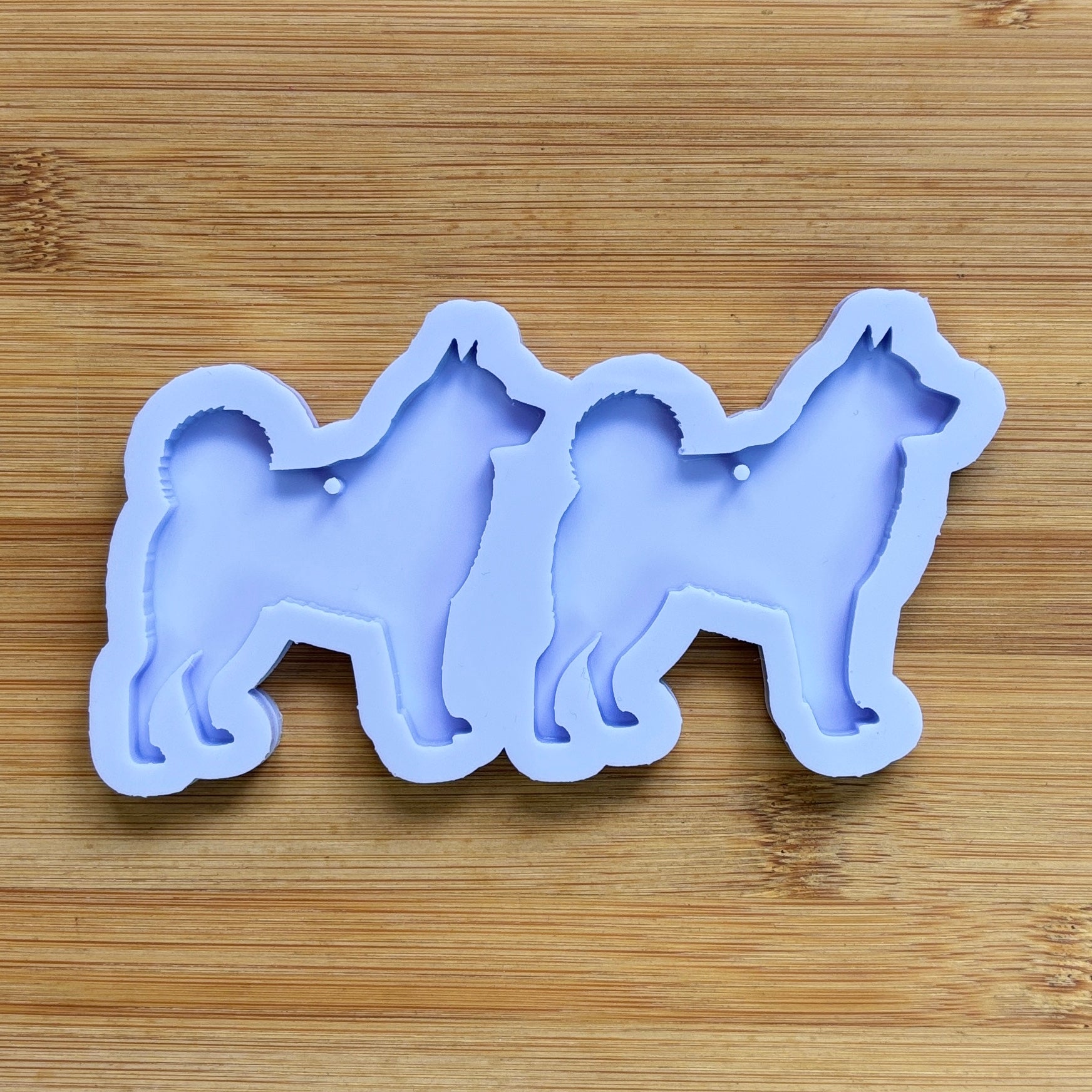 Norwegian Elkhound Silhouette Silicone Mold with 2 cavities, made with Food Safe Silicone suitable for both food and craft projects.