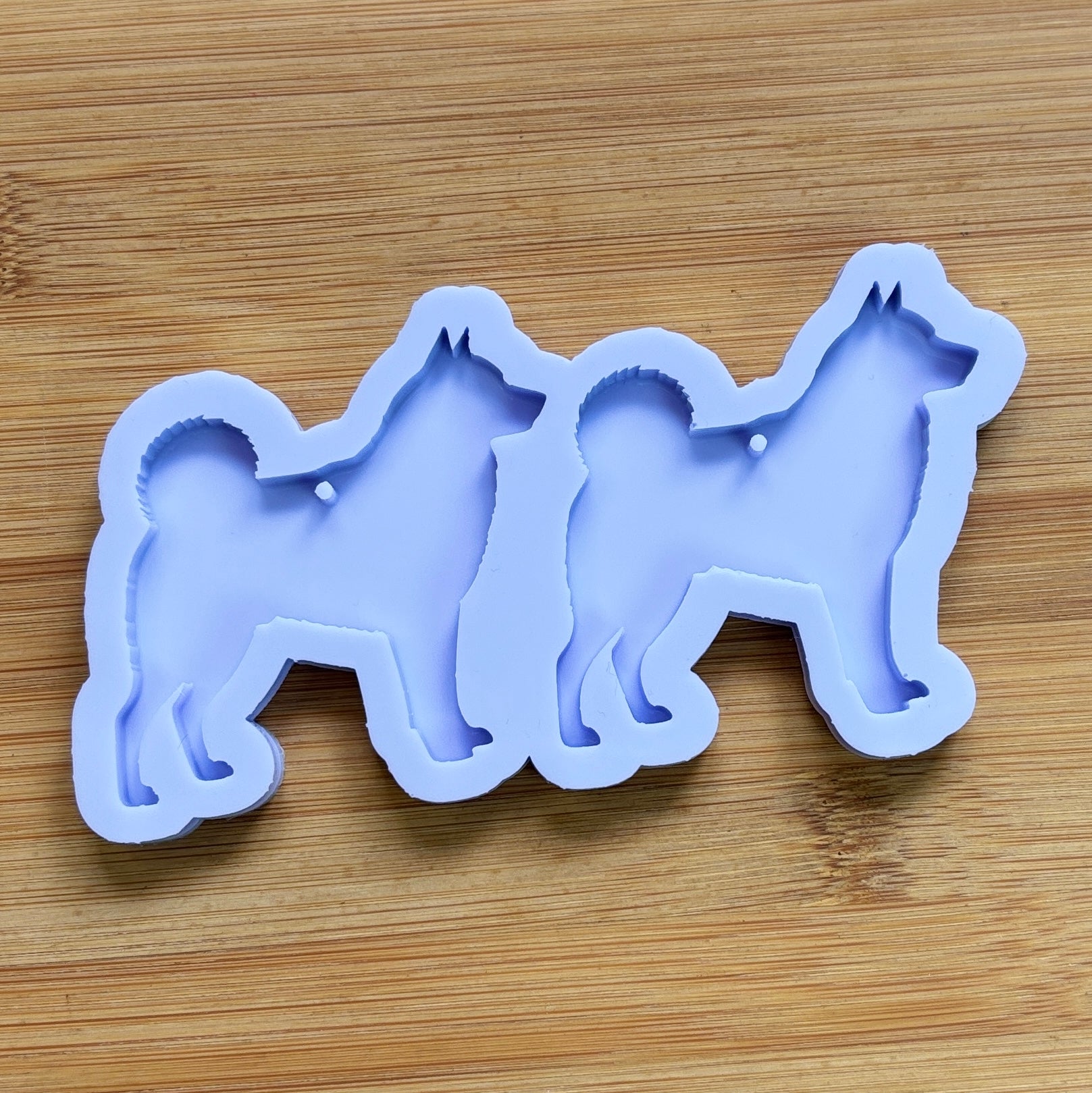 Norwegian Elkhound Silhouette Silicone Mold with 2 cavities, made with Food Safe Silicone suitable for both food and craft projects.