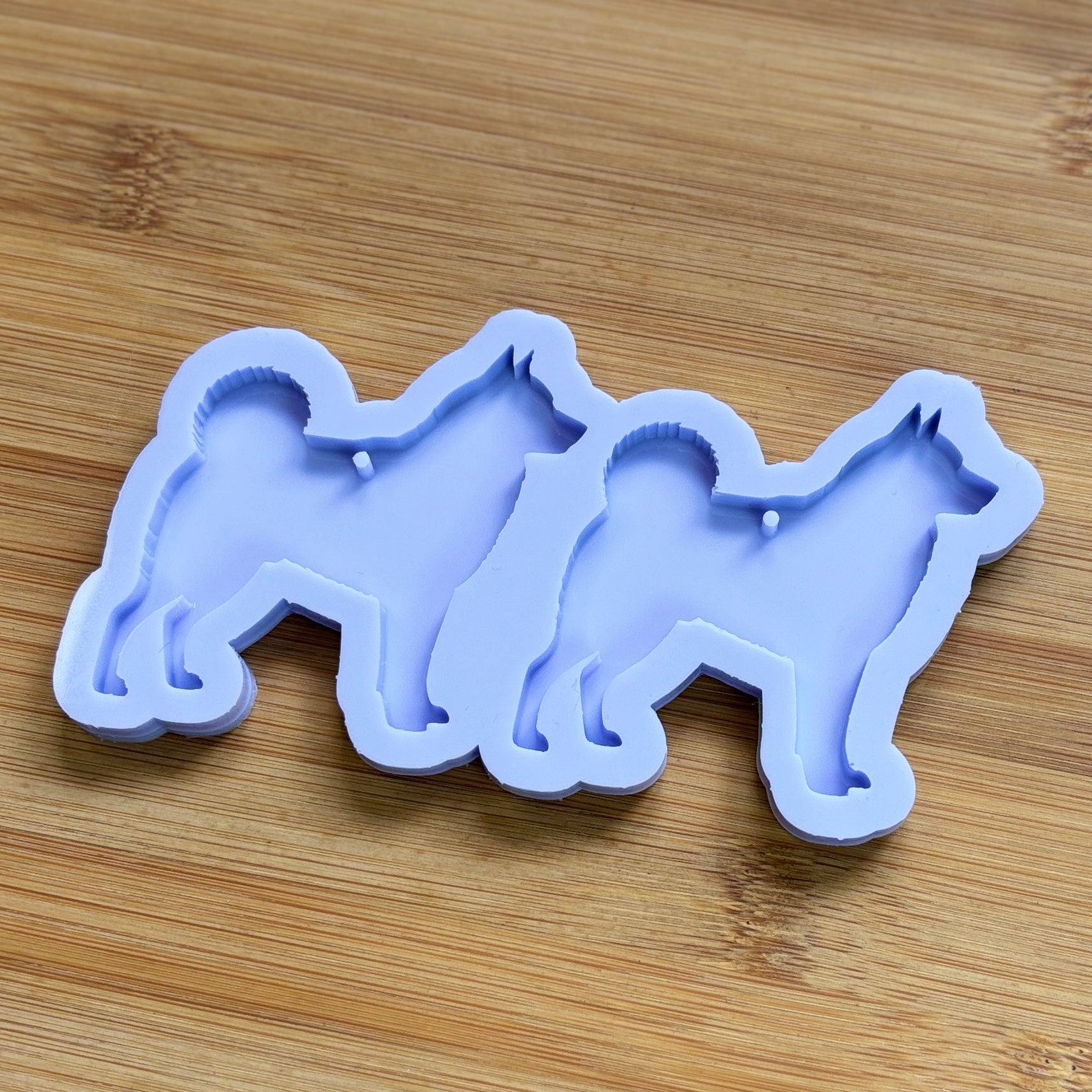 Norwegian Elkhound Silhouette Silicone Mold with 2 cavities, made with Food Safe Silicone suitable for both food and craft projects.