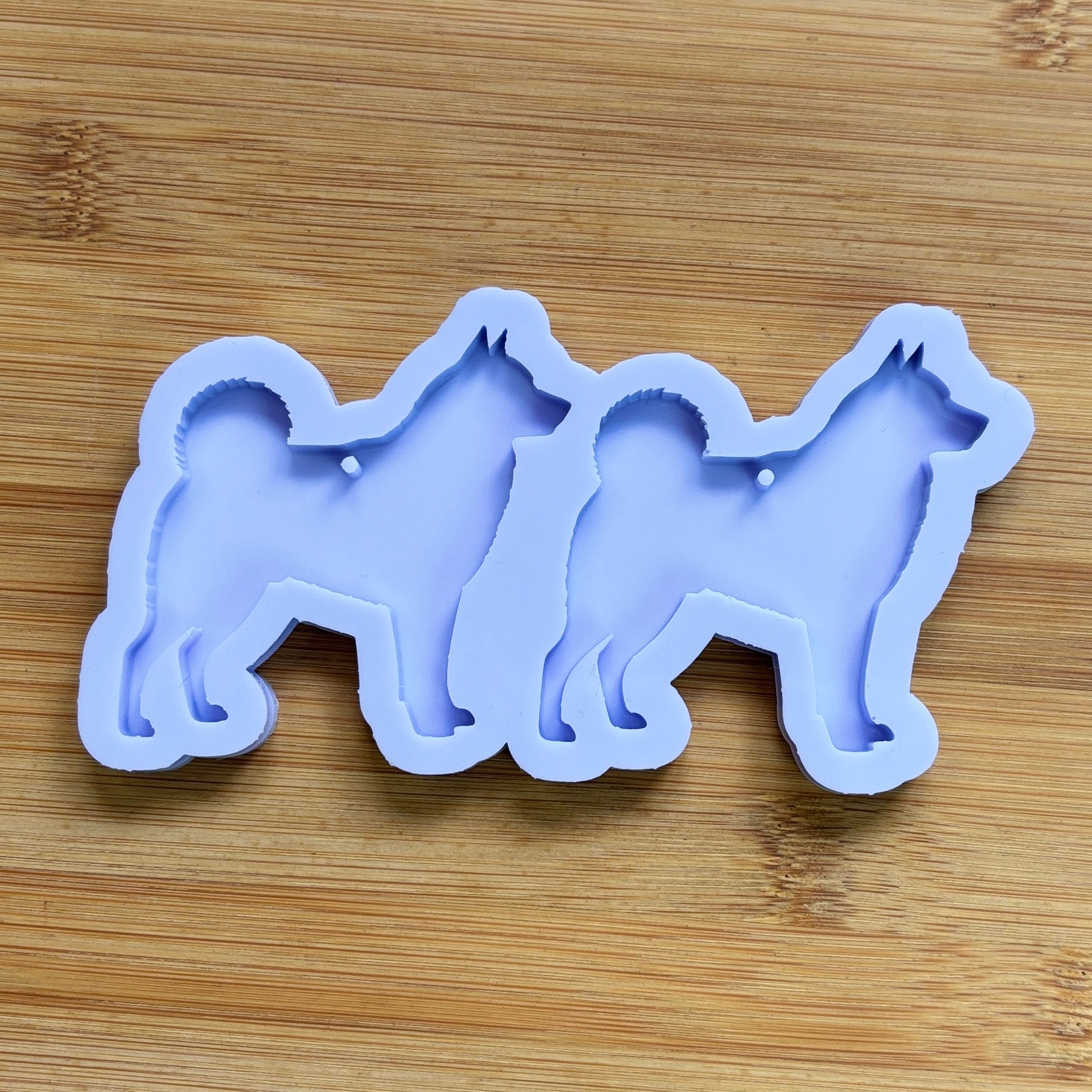 Norwegian Elkhound Silhouette Silicone Mold with 2 cavities, made with Food Safe Silicone suitable for both food and craft projects.