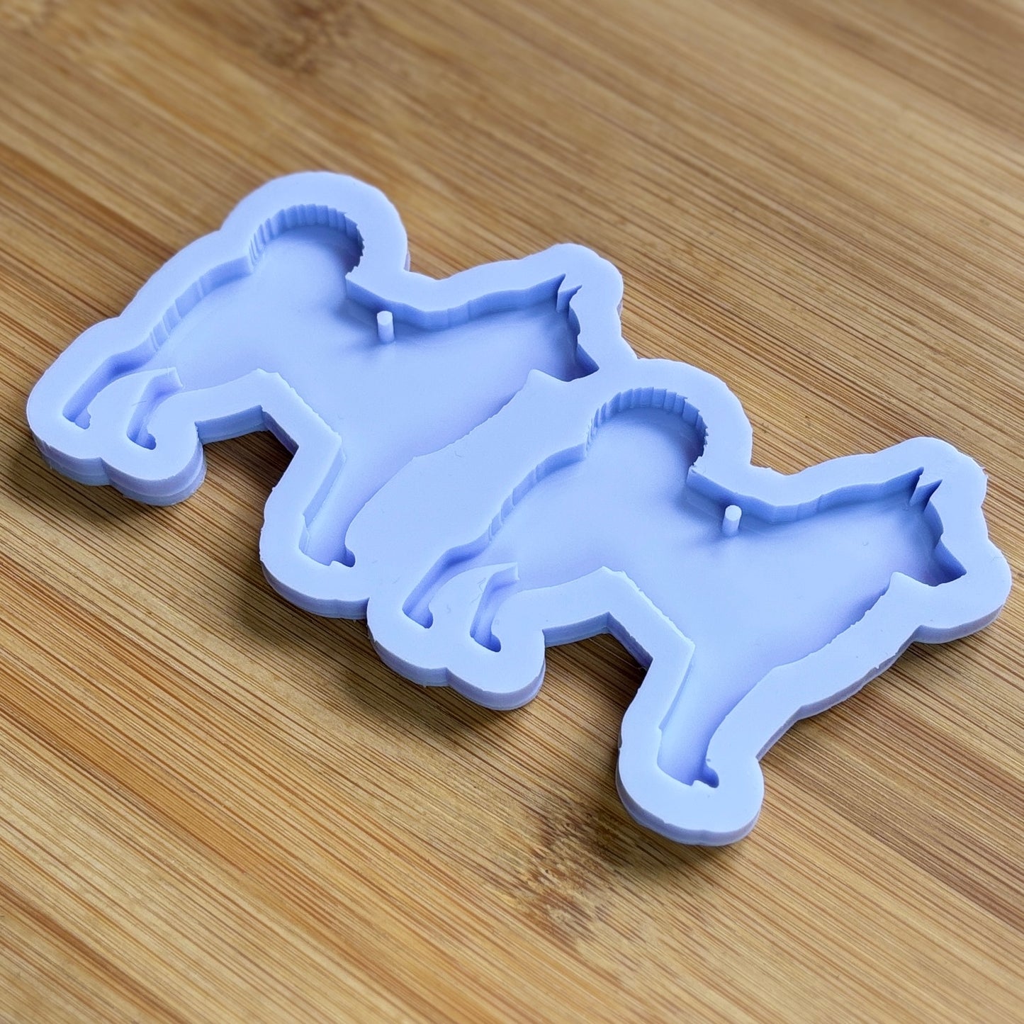 Norwegian Elkhound Silhouette Silicone Mold with 2 cavities, made with Food Safe Silicone suitable for both food and craft projects.