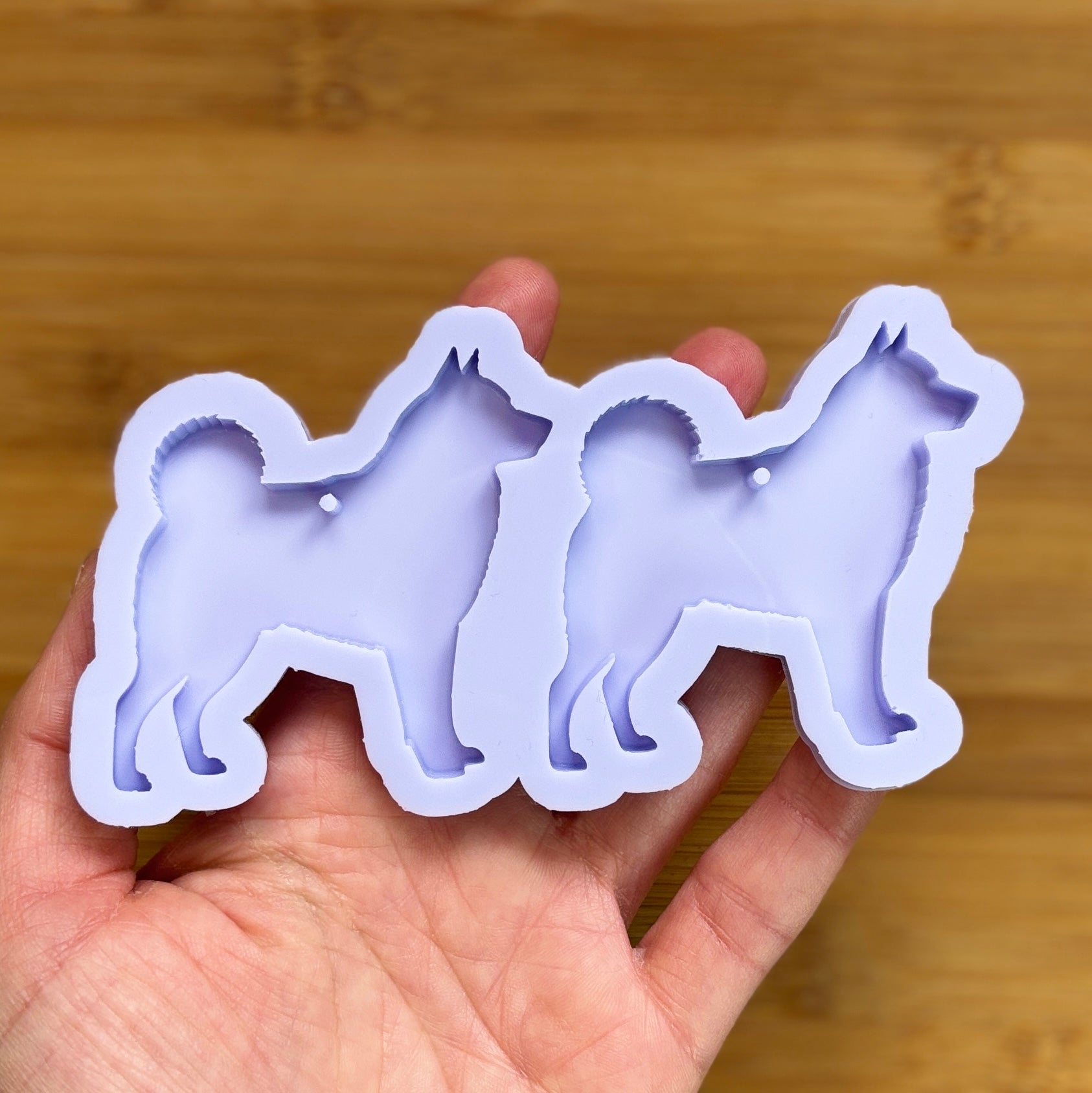 Norwegian Elkhound Silhouette Silicone Mold with 2 cavities, made with Food Safe Silicone suitable for both food and craft projects.