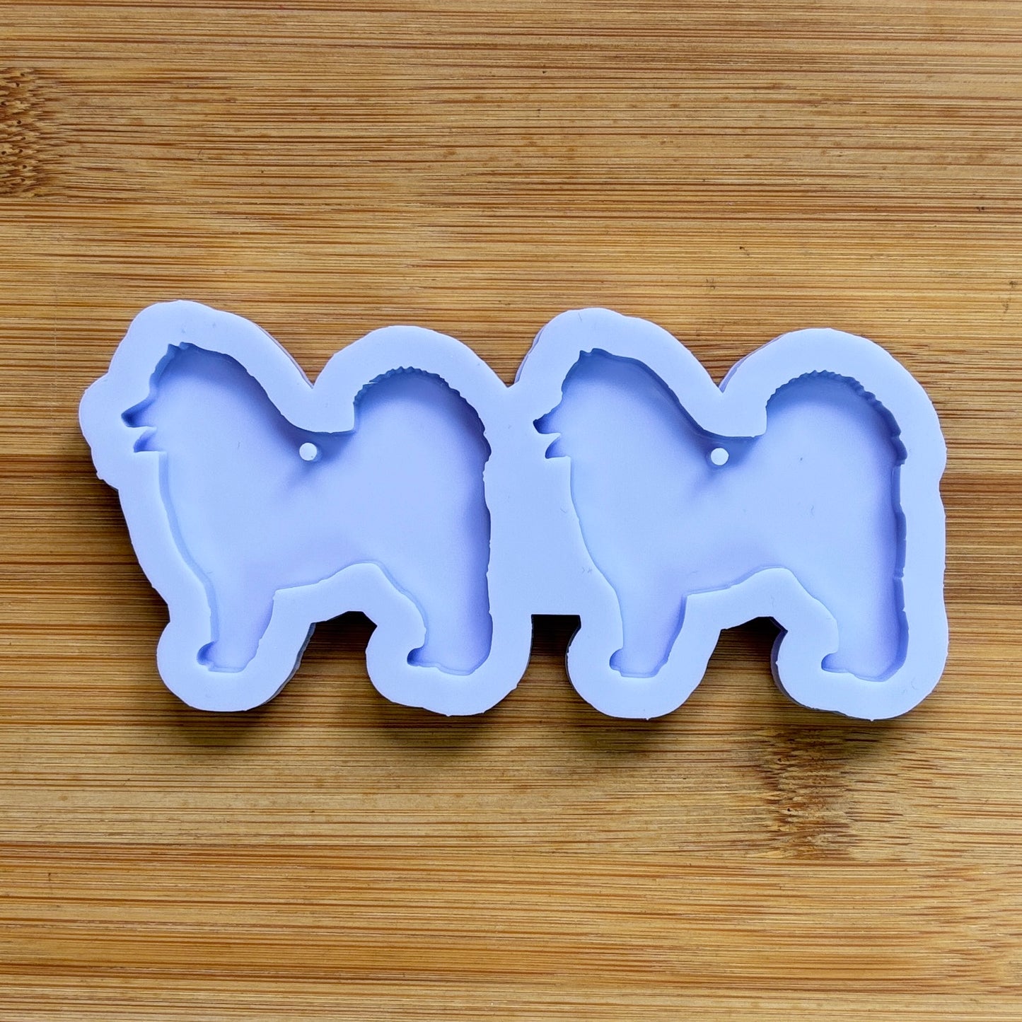 Samoyed Silhouette Silicone Mold with 2 cavities, made with Food Safe Silicone suitable for both food and craft projects.