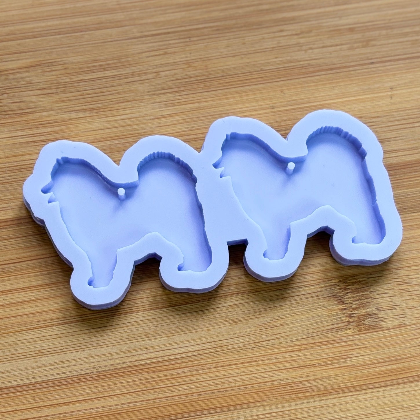 Samoyed Silhouette Silicone Mold with 2 cavities, made with Food Safe Silicone suitable for both food and craft projects.