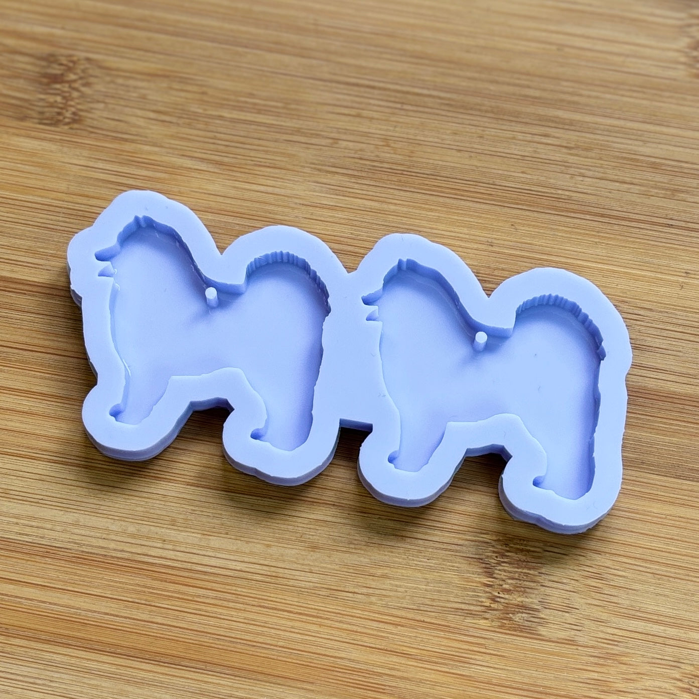 Samoyed Silhouette Silicone Mold with 2 cavities, made with Food Safe Silicone suitable for both food and craft projects.
