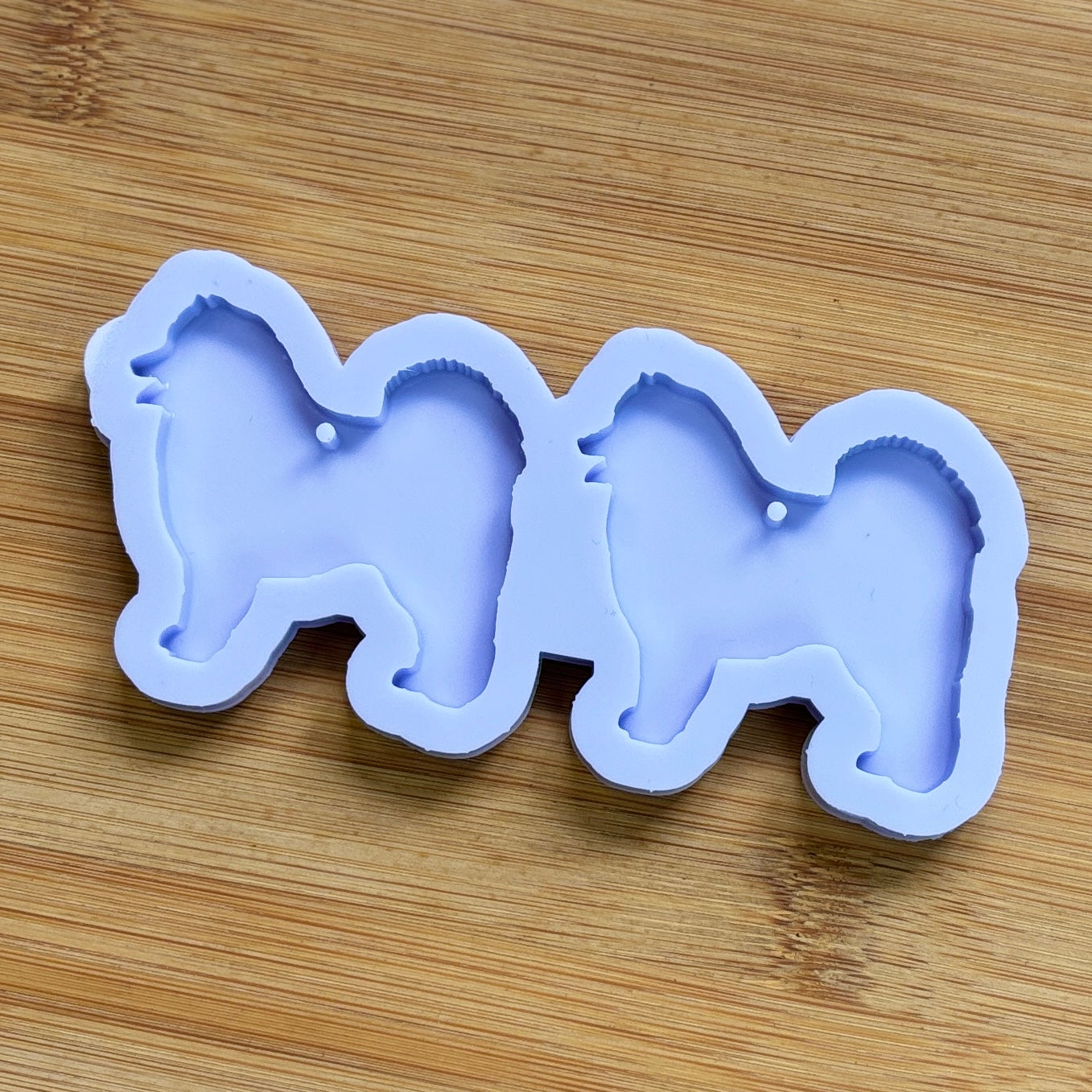 Samoyed Silhouette Silicone Mold with 2 cavities, made with Food Safe Silicone suitable for both food and craft projects.