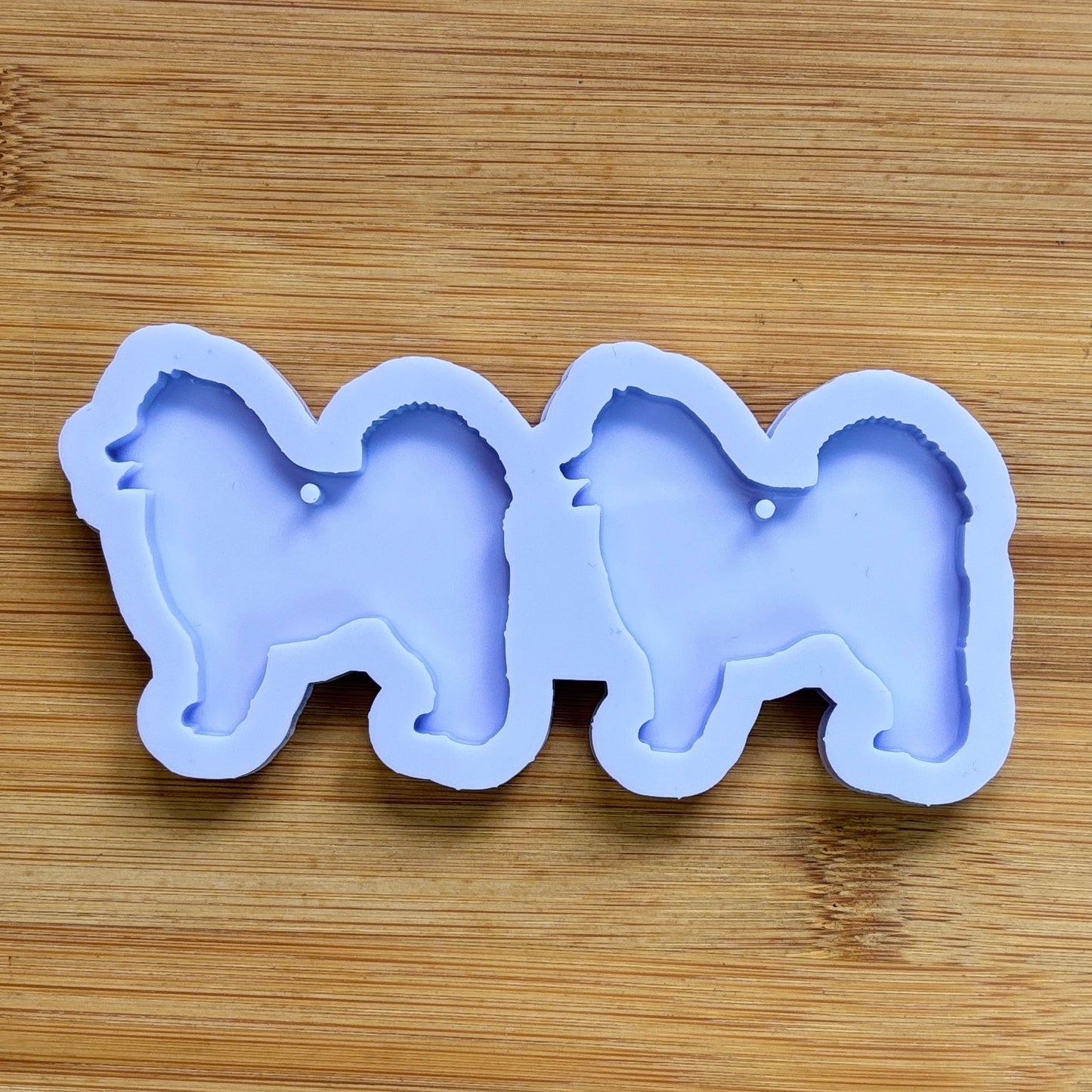Samoyed Silhouette Silicone Mold with 2 cavities, made with Food Safe Silicone suitable for both food and craft projects.