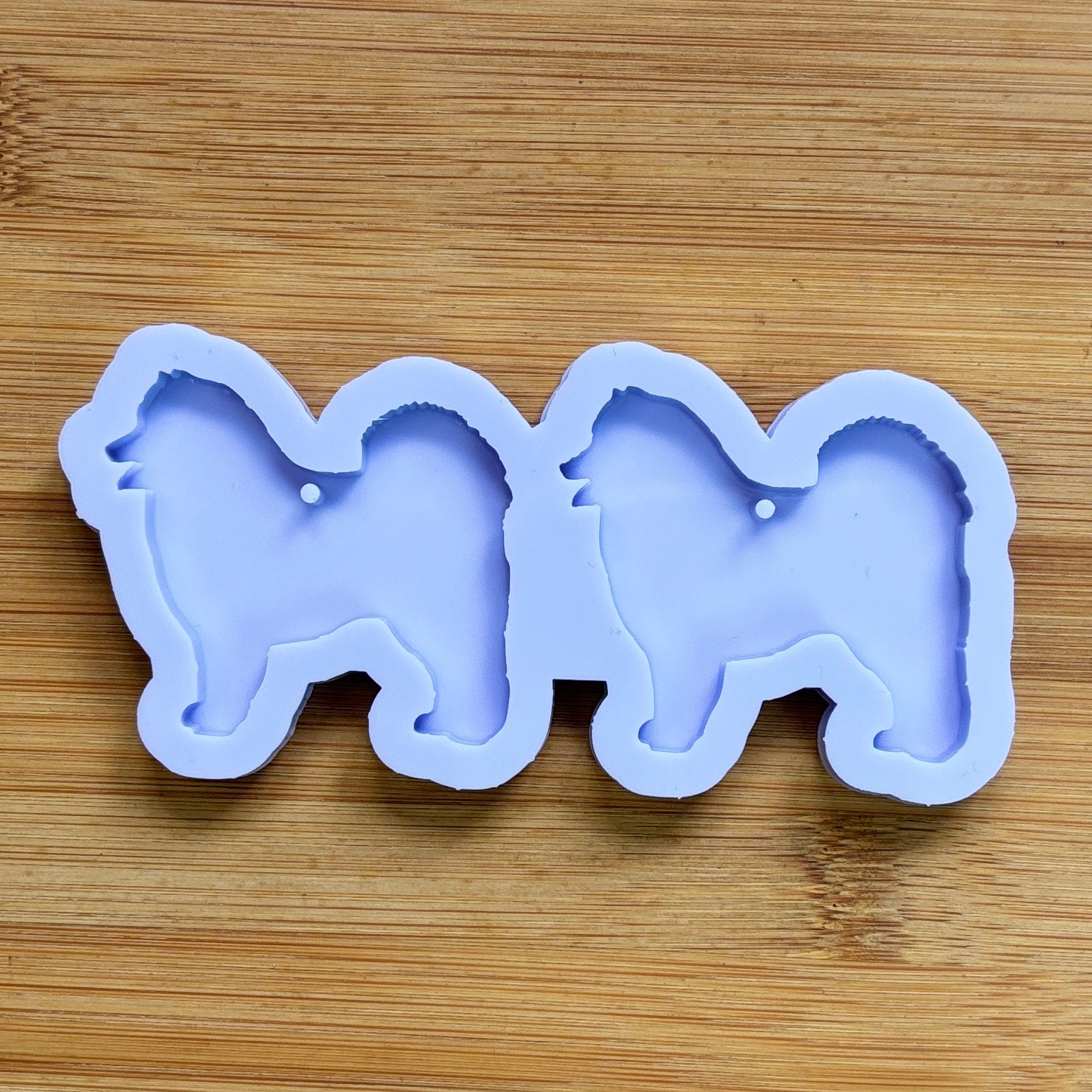Samoyed Silhouette Silicone Mold with 2 cavities, made with Food Safe Silicone suitable for both food and craft projects.