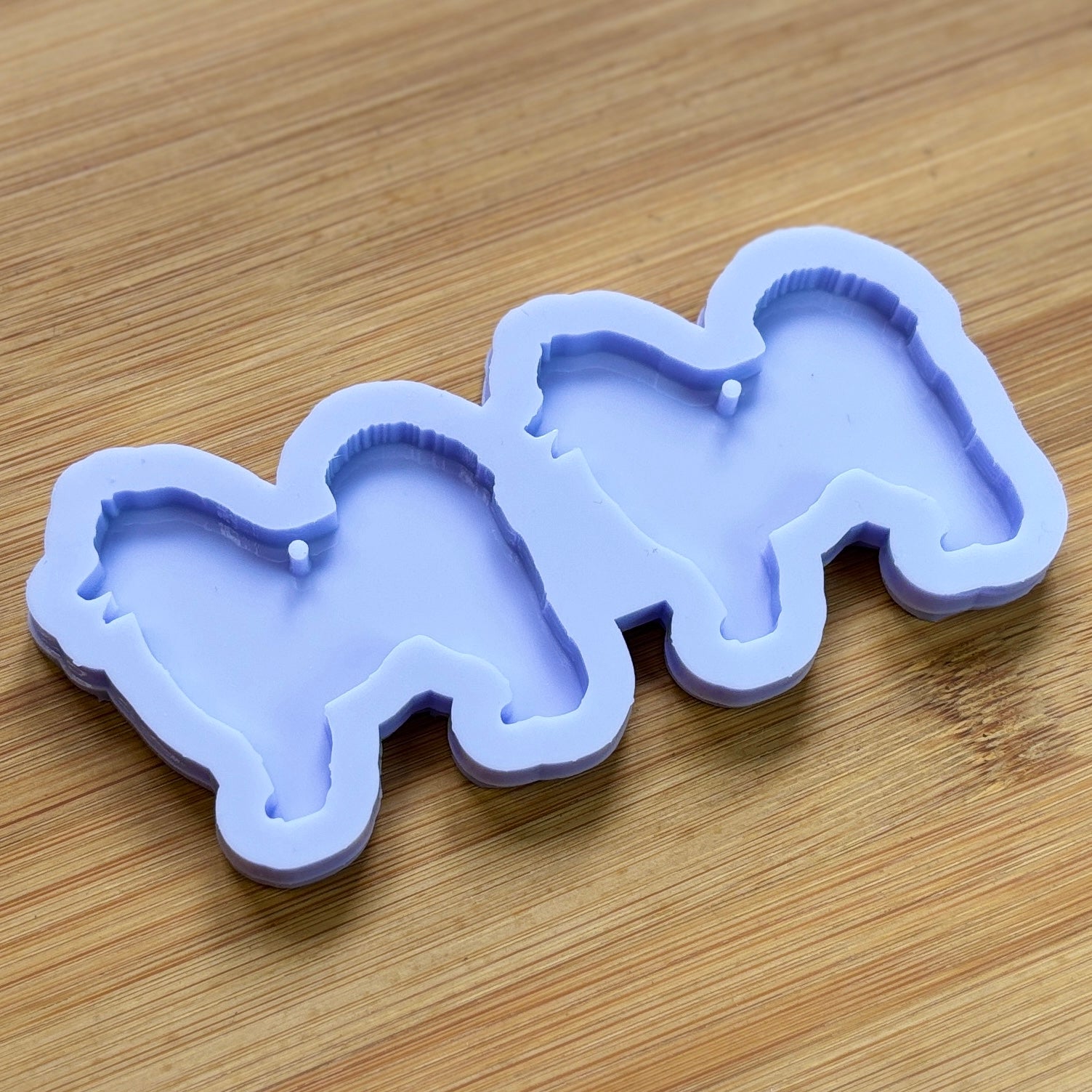 Samoyed Silhouette Silicone Mold with 2 cavities, made with Food Safe Silicone suitable for both food and craft projects.