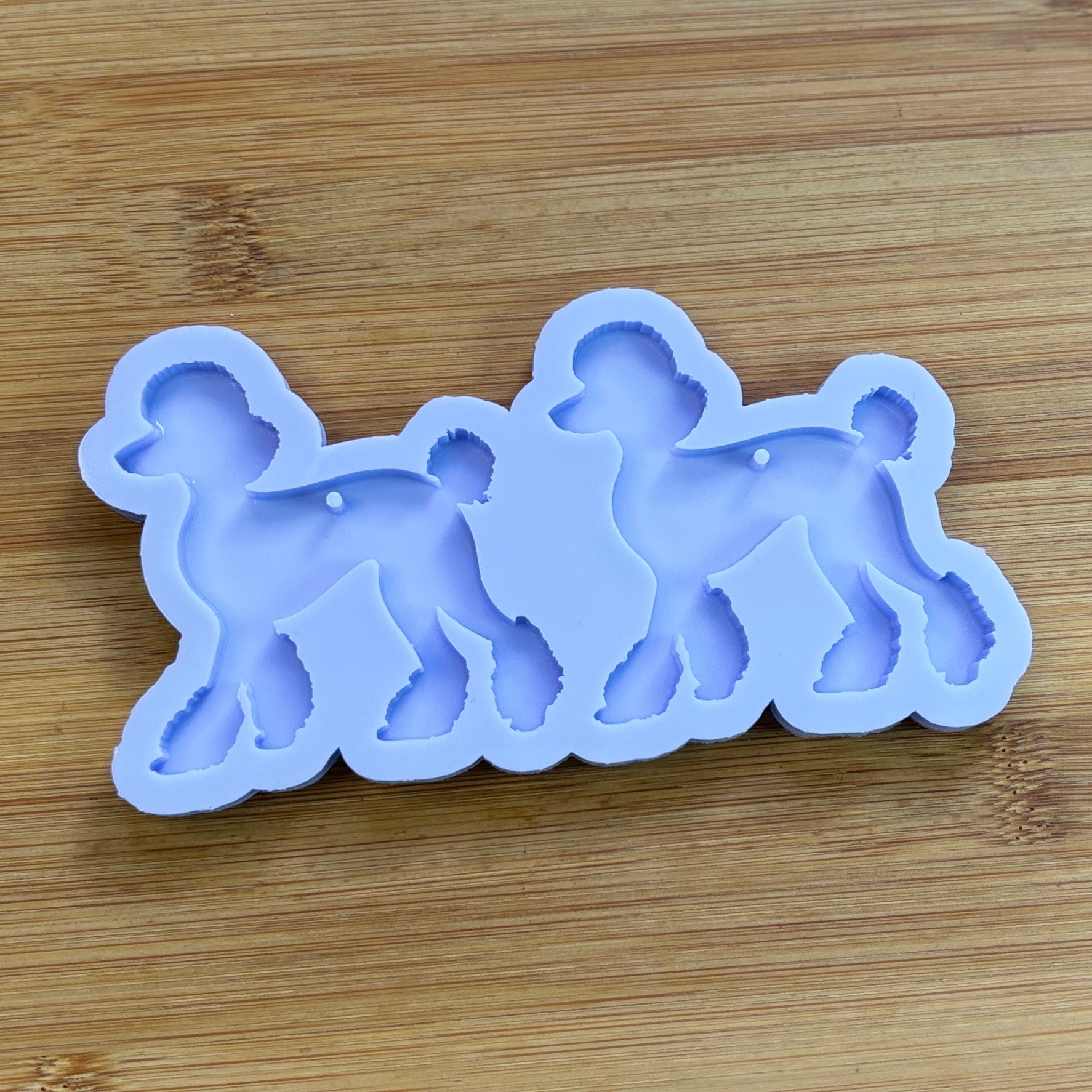 Poodle Silicone Mold with 2 cavities, made with Food Safe Silicone suitable for both food and craft projects.