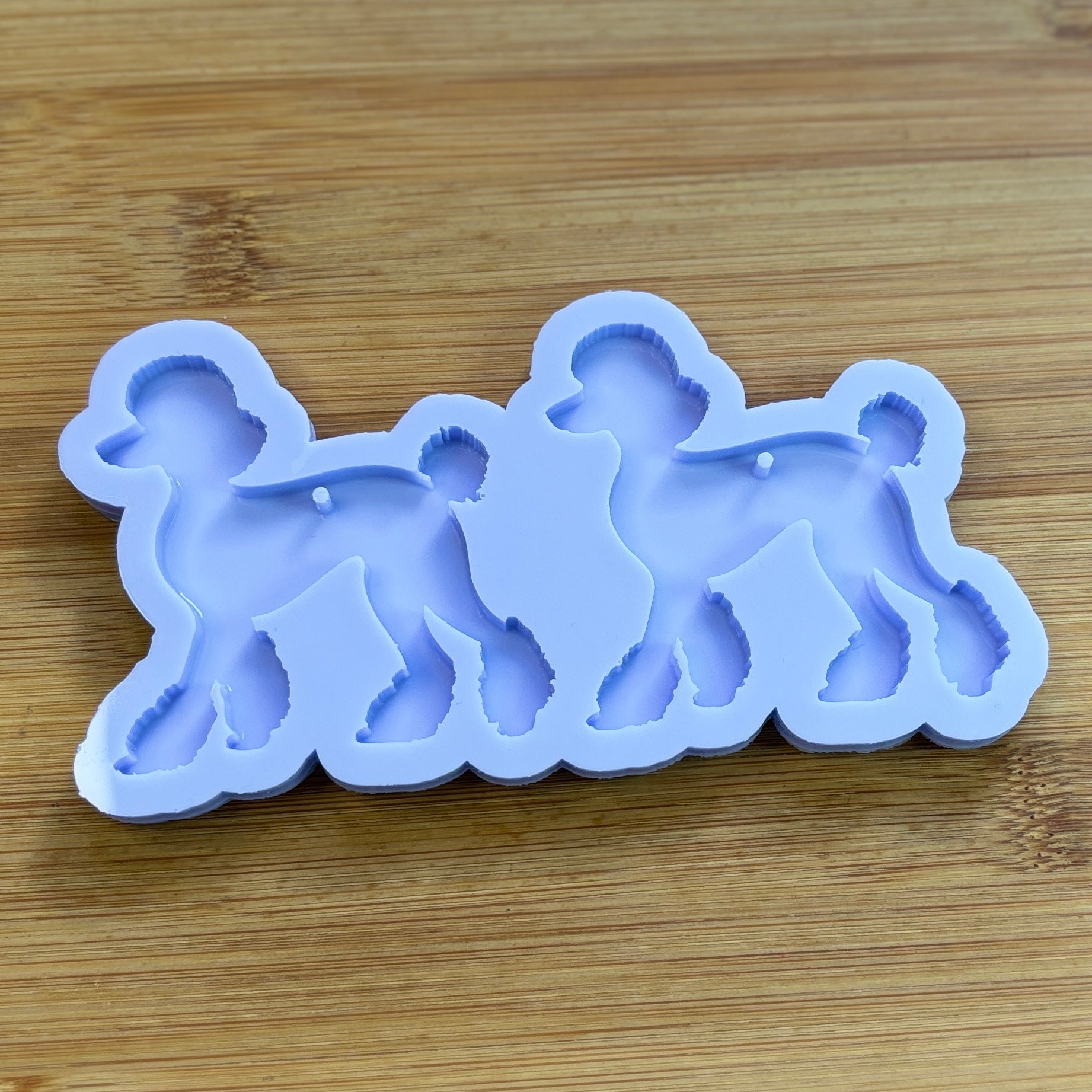 Poodle Silicone Mold with 2 cavities, made with Food Safe Silicone suitable for both food and craft projects.