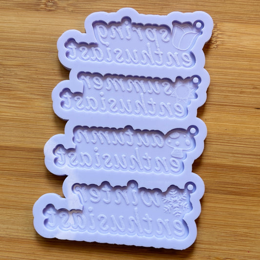 Set of silicone mold with decorative text on a wooden surface