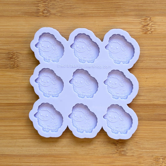 Sheep-shaped silicone mold on a wooden surface