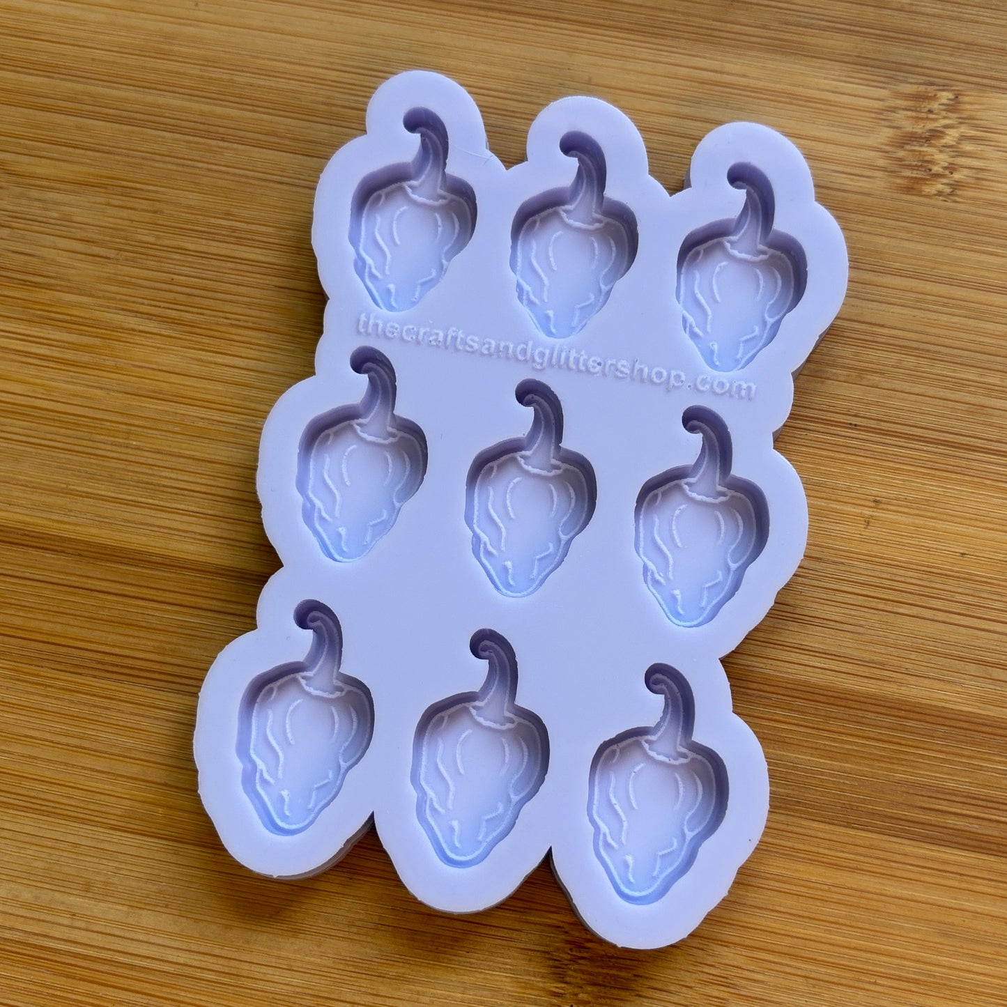 Silicone mold with habanero shapes on a wooden surface