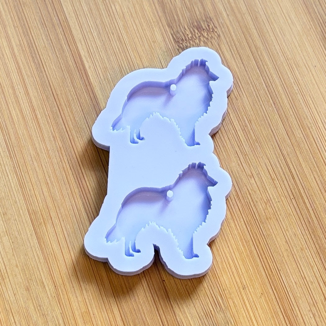 Silicone mold shaped like a dog on a wooden surface