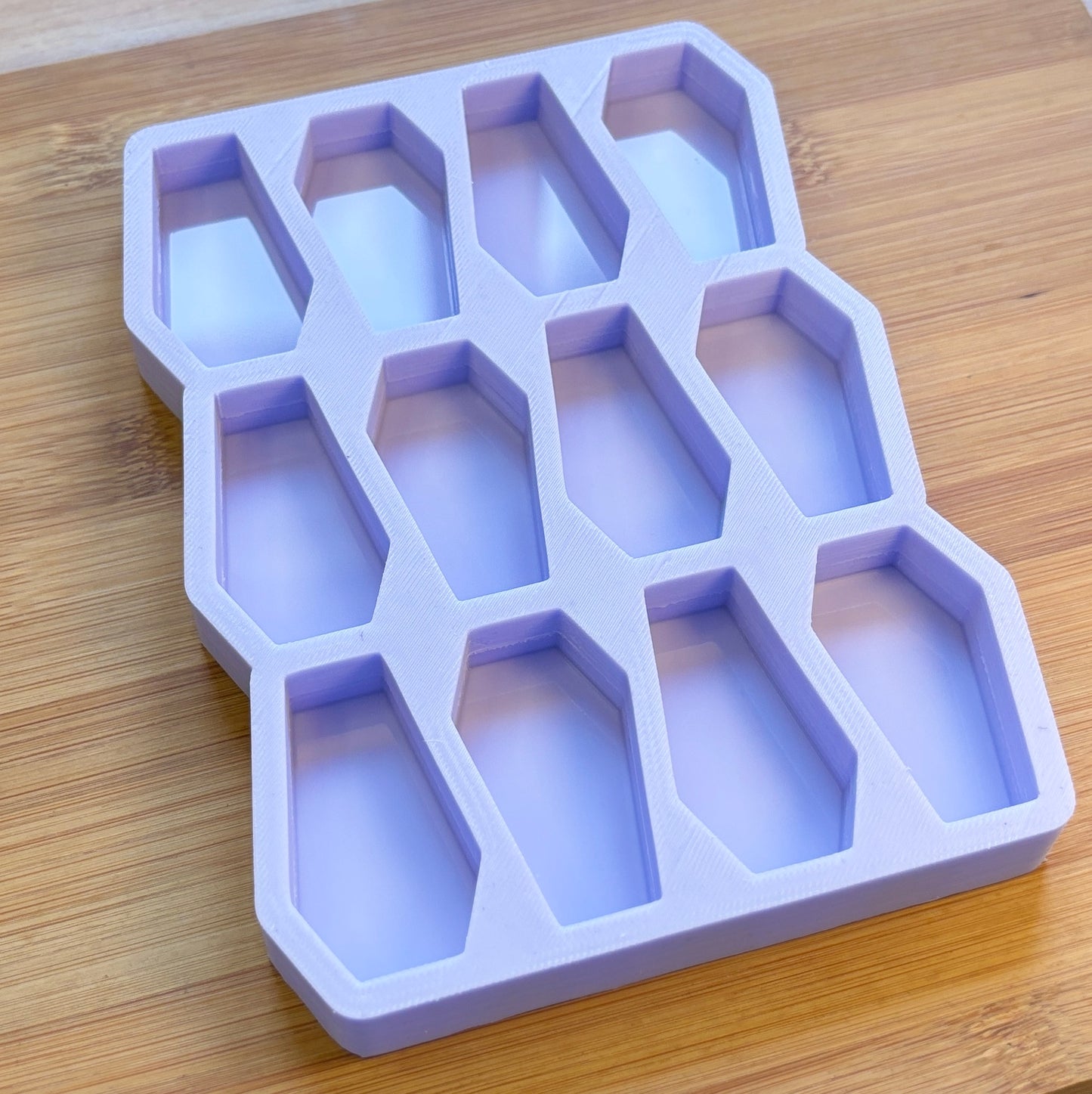 Silicone ice cube tray on a wooden surface