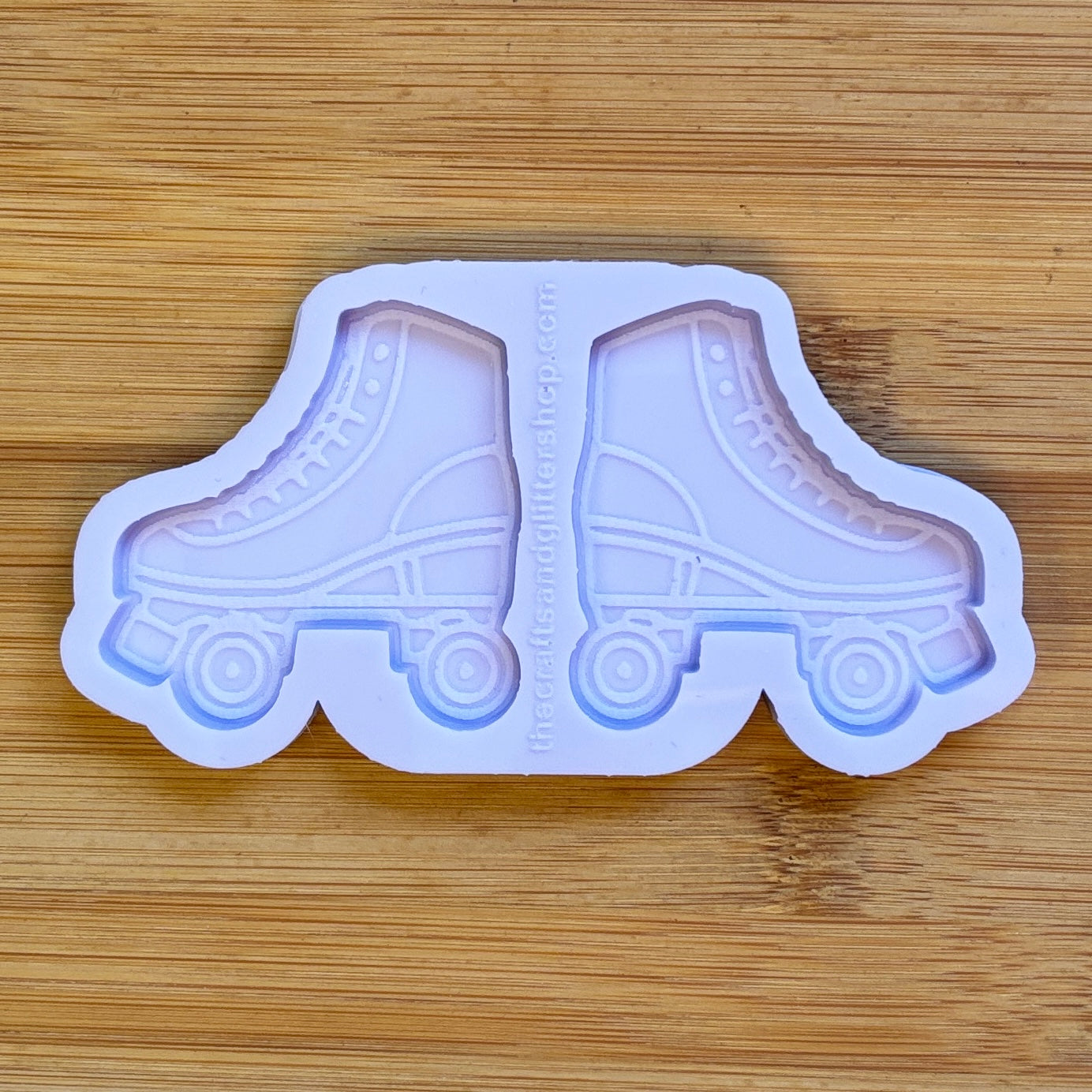 Roller skate-shaped mold on a wooden surface