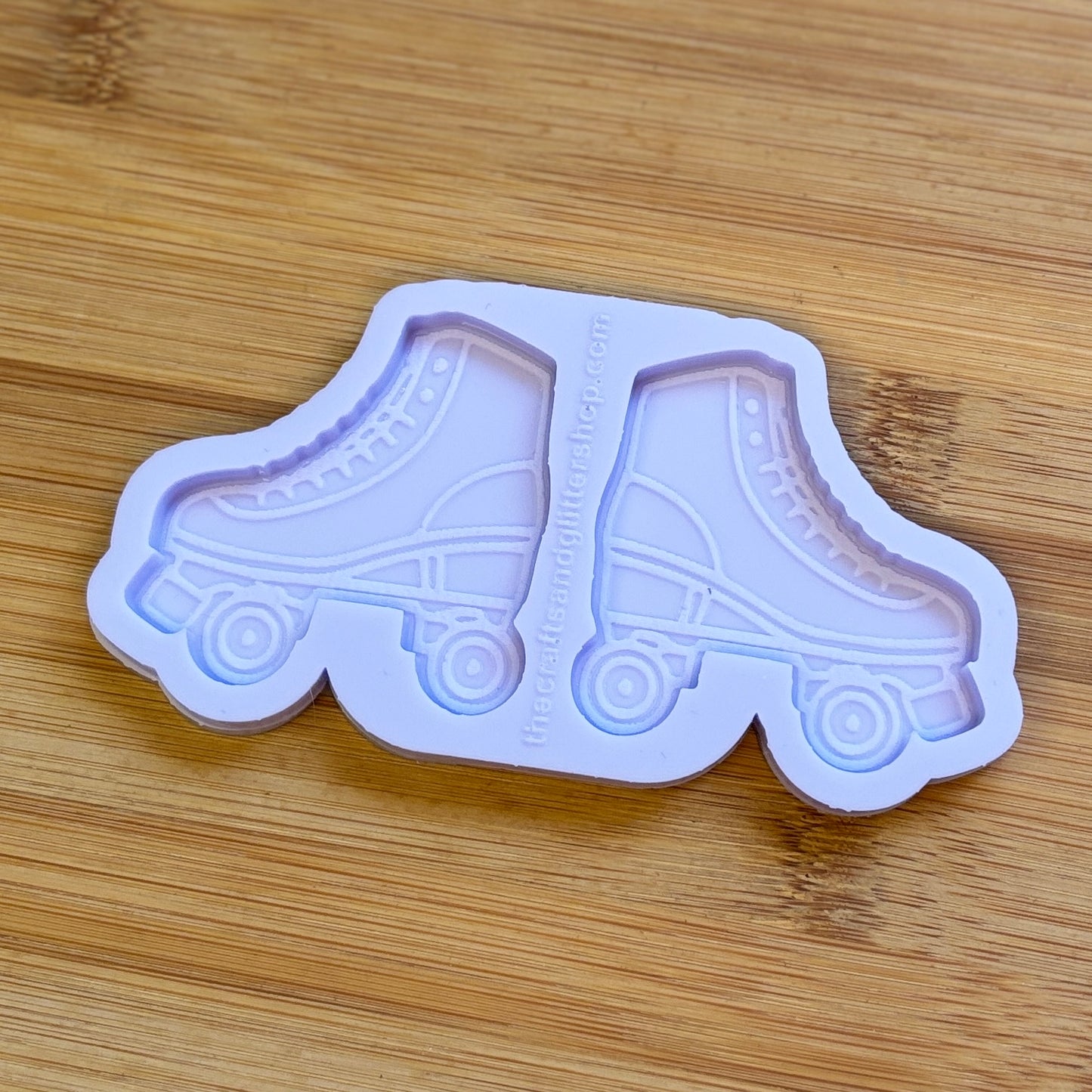 Roller skate-shaped mold on a wooden surface